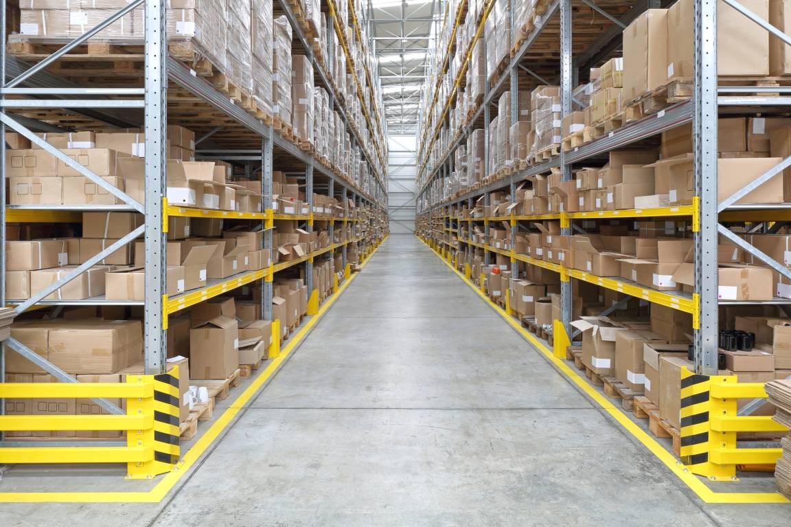 Long aisle with shelves and files in a warehouse